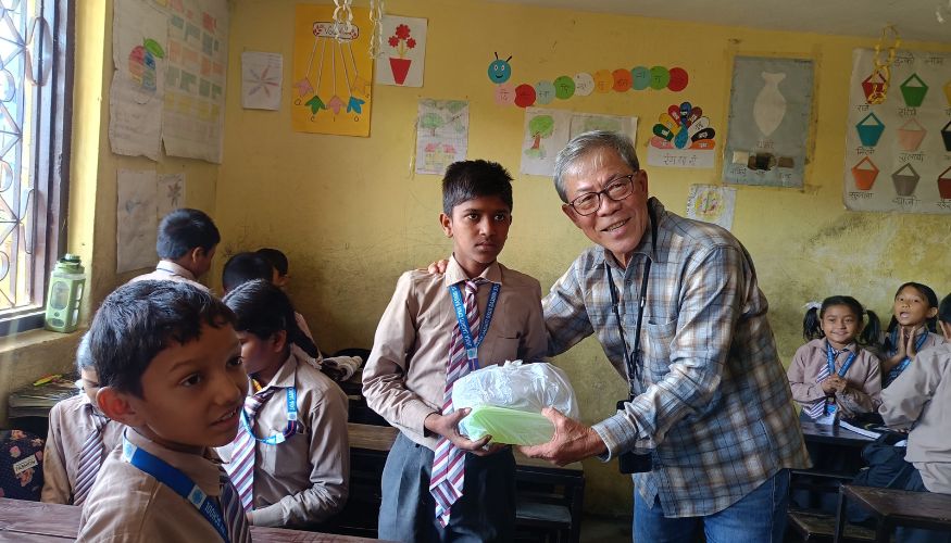Our Client Phu Donating Educational Supplies To Local School In Nepal